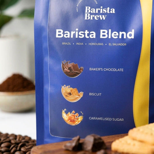 Barista Brew Barista Blend coffee package with chocolate, biscuit, and caramelised sugar flavors on a blurred background.